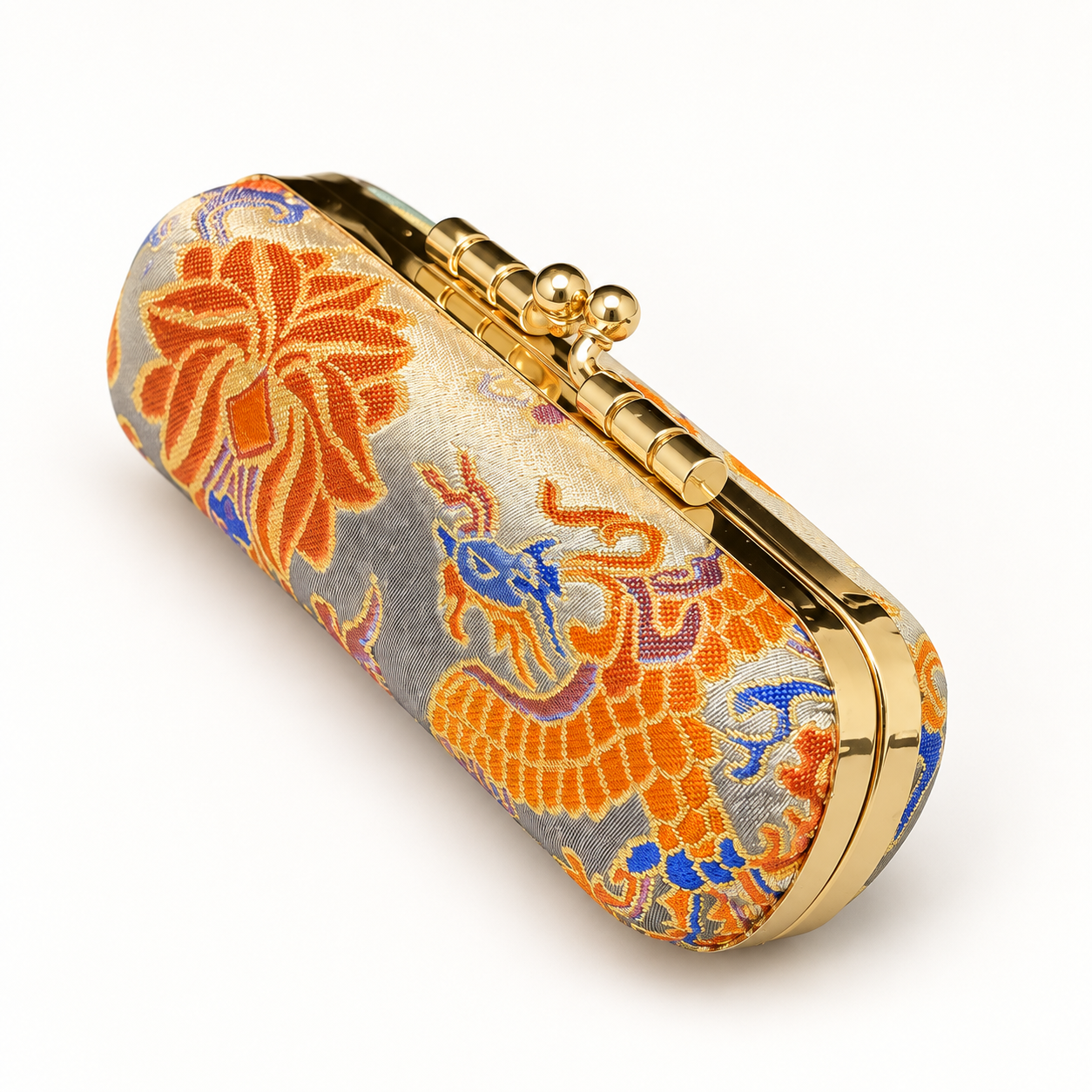 Closed orange Song brocade jewelry travel kit with its patterned exterior.
