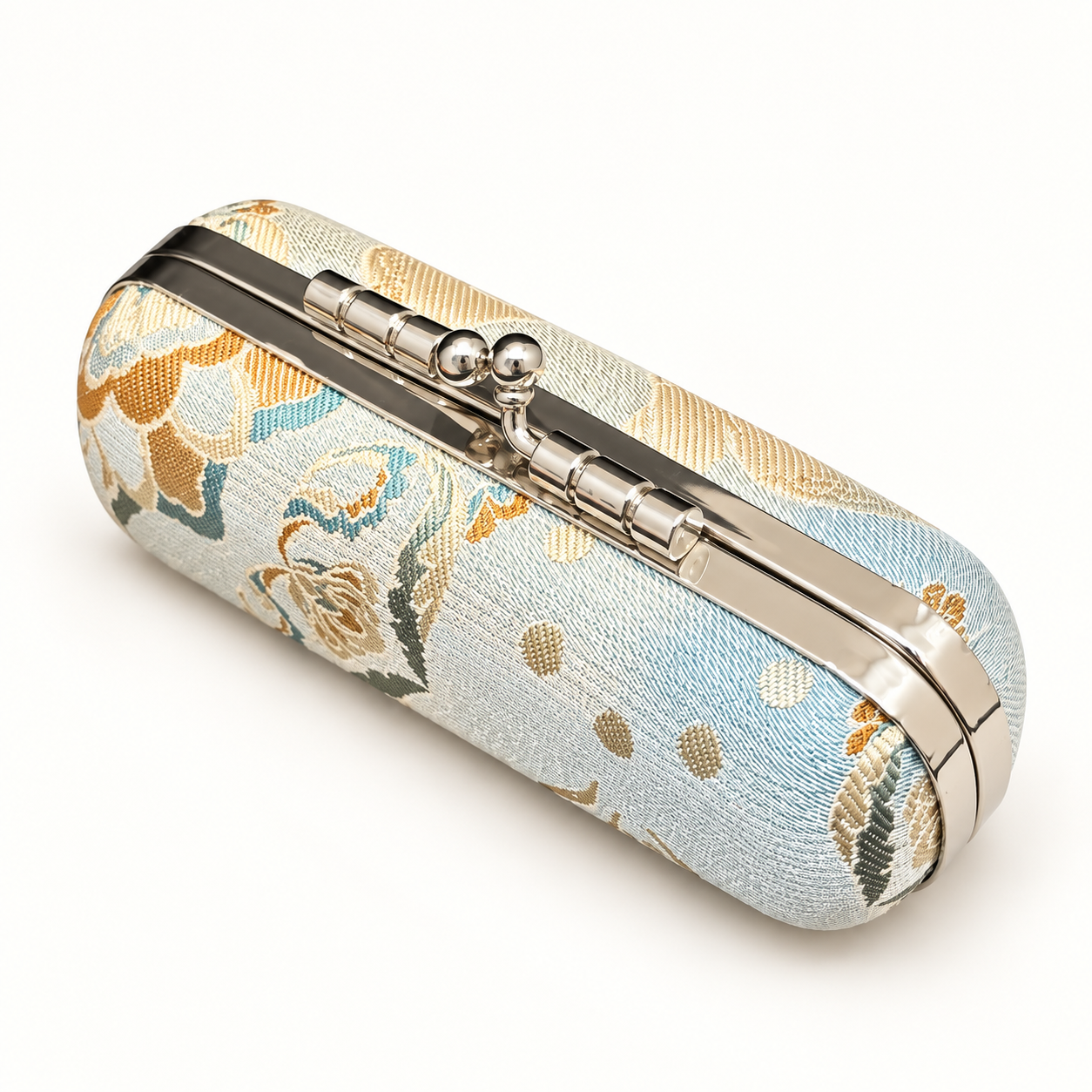 Closed pale-blue Song brocade jewelry travel kit with its patterned exterior.