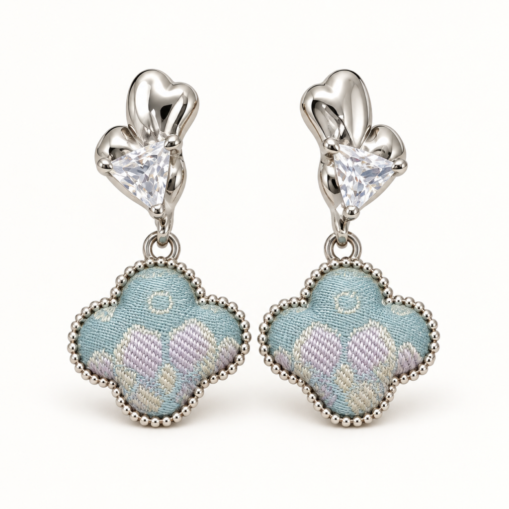 Pair of pale-blue patterned Song brocade cloud drop earrings with clear triangular zircon accents.