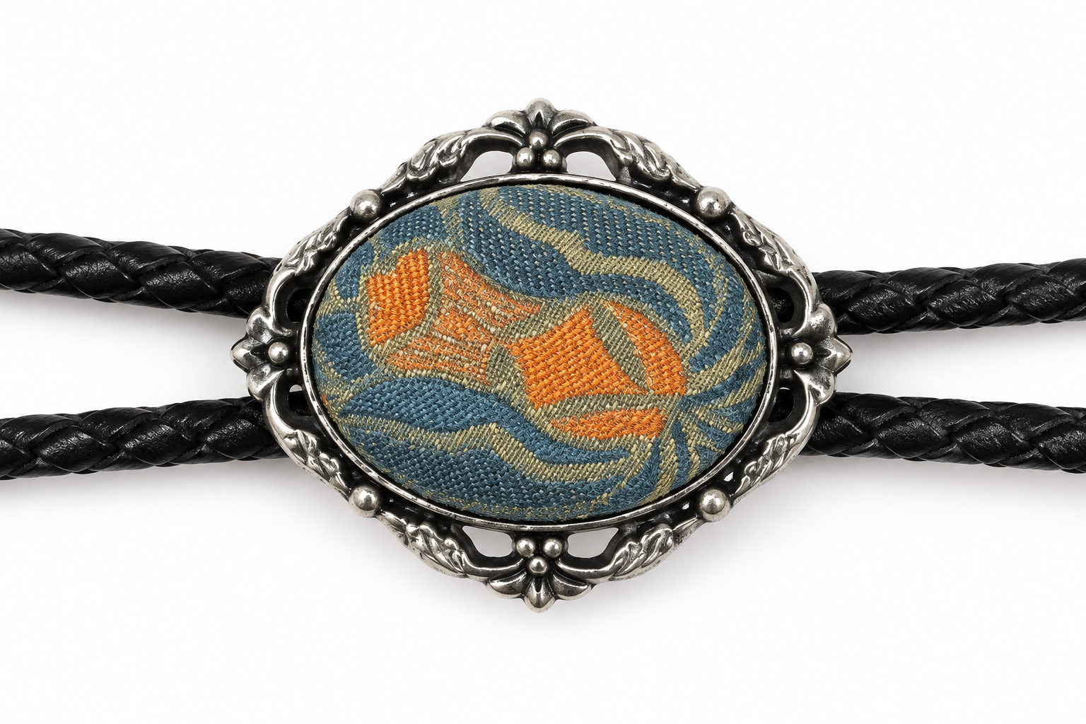 Close view of the pale-blue woven centerpiece with orange-and-gold-color motif in a silver-color oval frame.