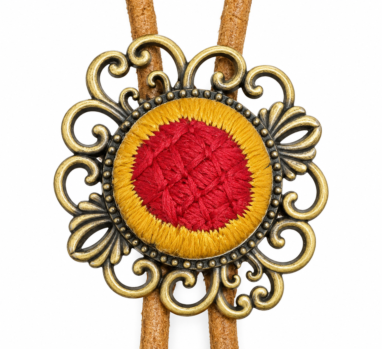 Close view of the red woven center, mustard-color border, and antique-brass-color scrollwork frame.