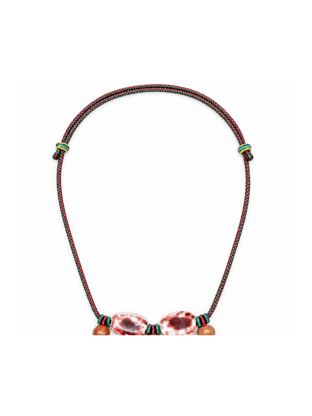 Wider view of the red and green braided necklace cord and adjustment points.