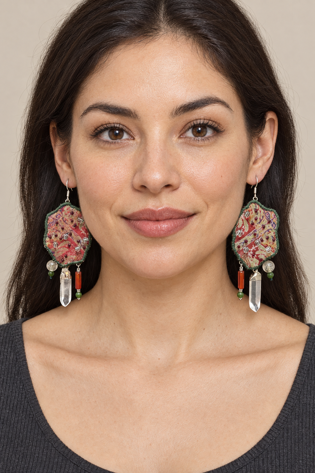 Full-face lifestyle view of a model wearing Inner Adventure Red-Gold Clear Point Earrings.