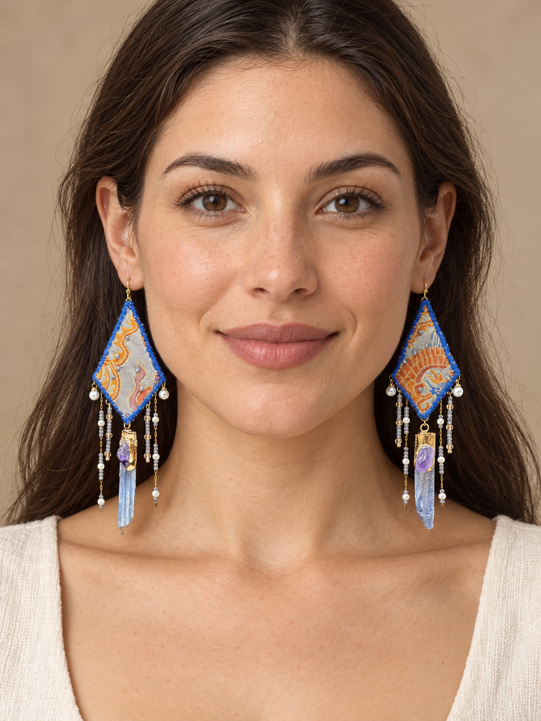 Full-face lifestyle view of a model wearing Inner Adventure Blue Diamond Fringe Earrings.