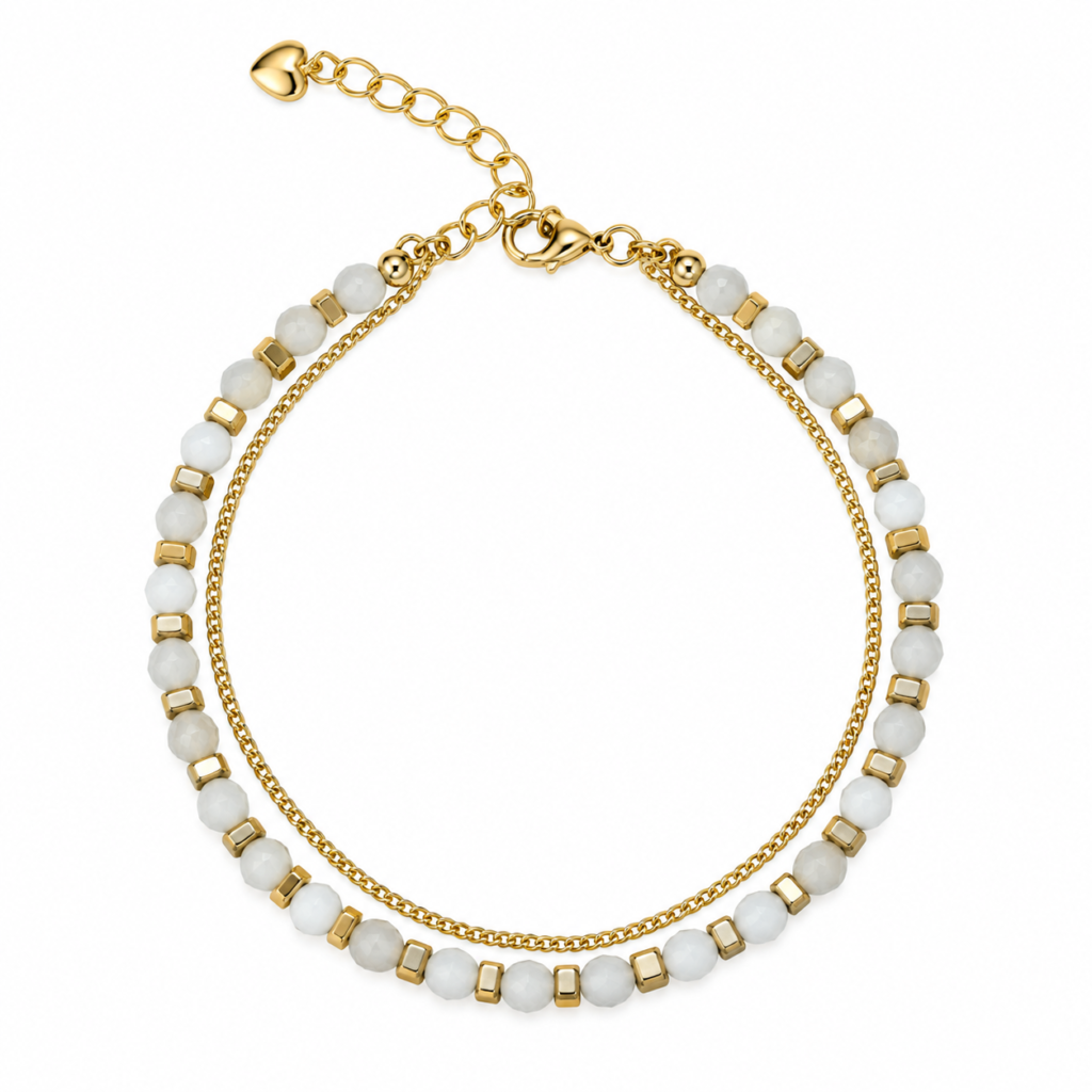 Ivory faceted bead double-strand bracelet with square gold-tone accents arranged on white.