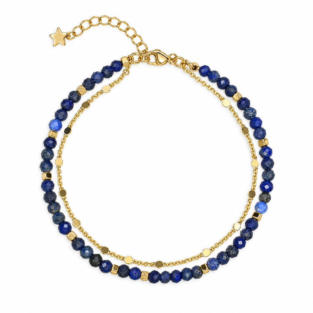 Midnight-blue faceted bead double-strand bracelet with gold-tone star charm on white.