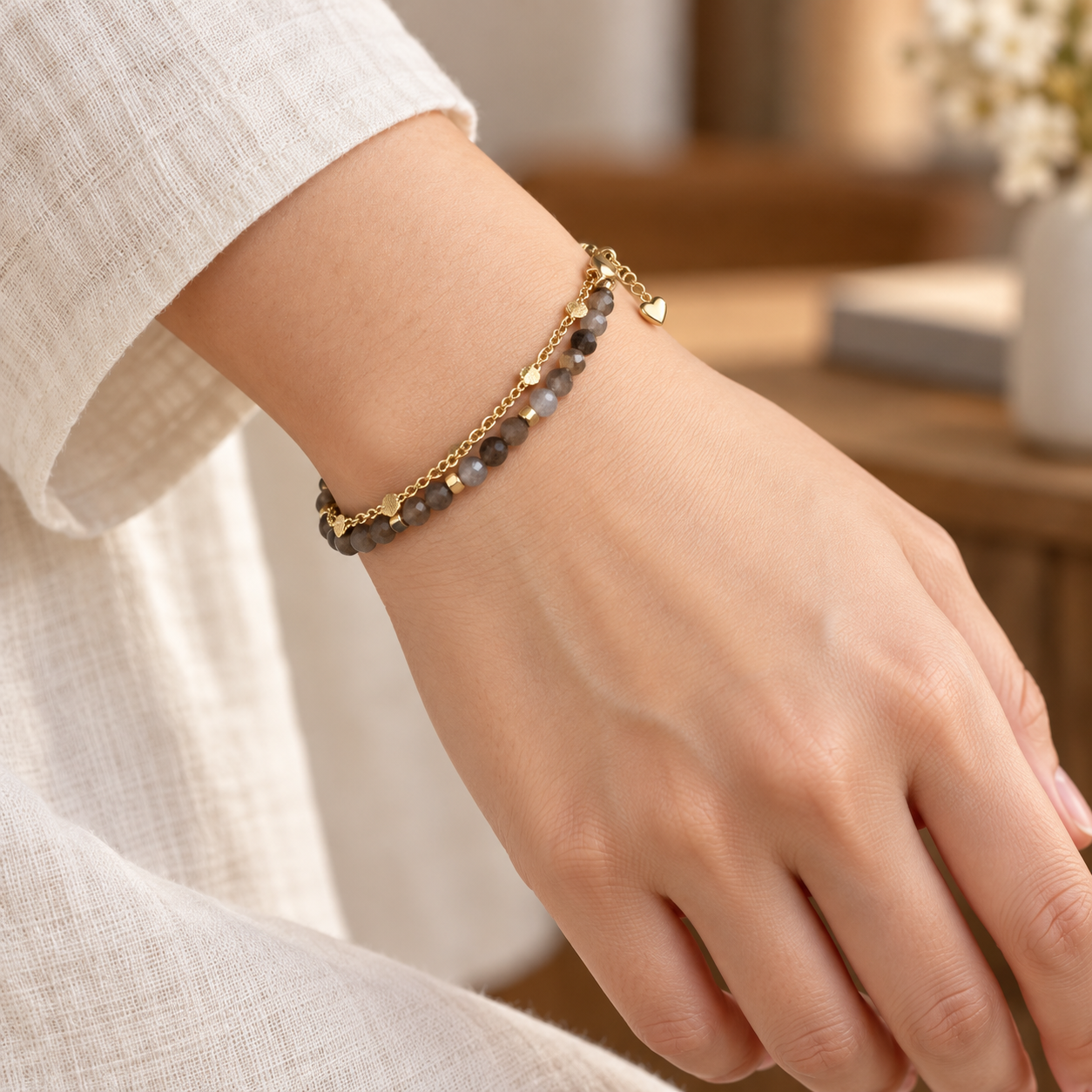 Close wrist view of the smoky brown faceted bead double-strand bracelet.