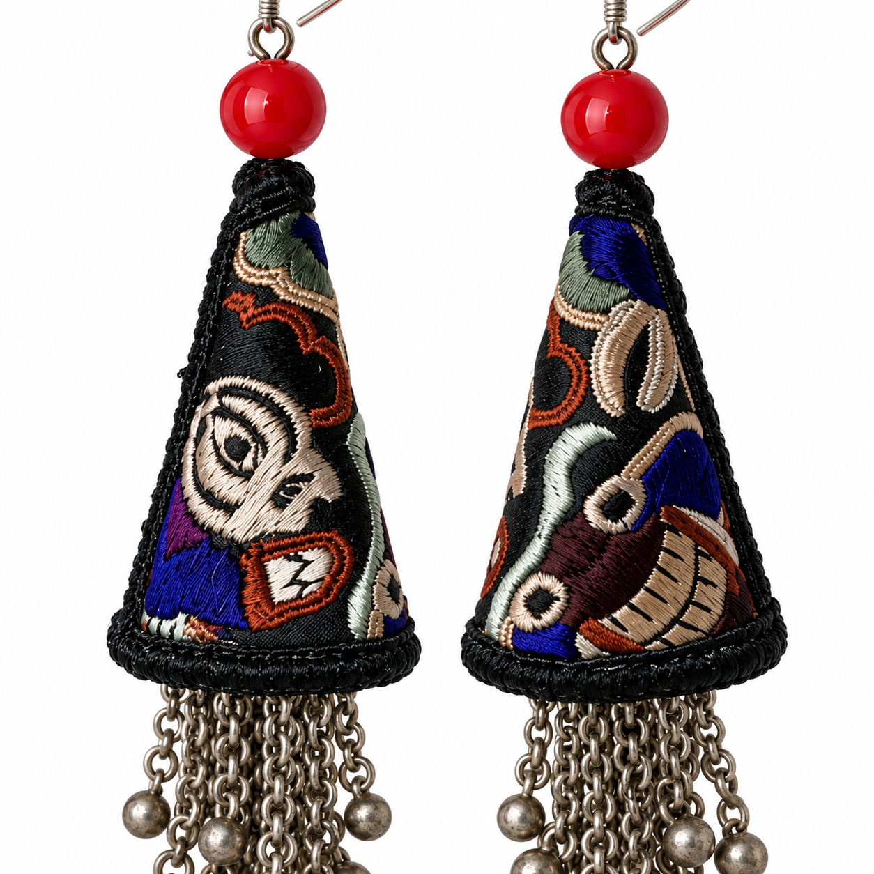 Close detail of the Miao embroidery and silver fittings on the Black Miao Embroidery Cone Tassel Earrings pair.
