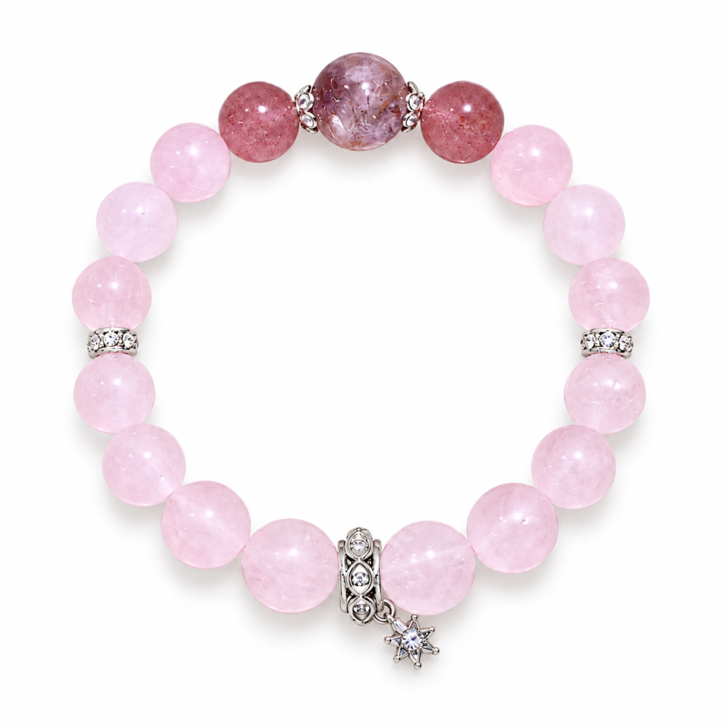 Pink quartz bracelet with two reddish accents, a larger cloudy mauve focal bead, silver-tone details and a small star charm, arranged in a circle on white.
